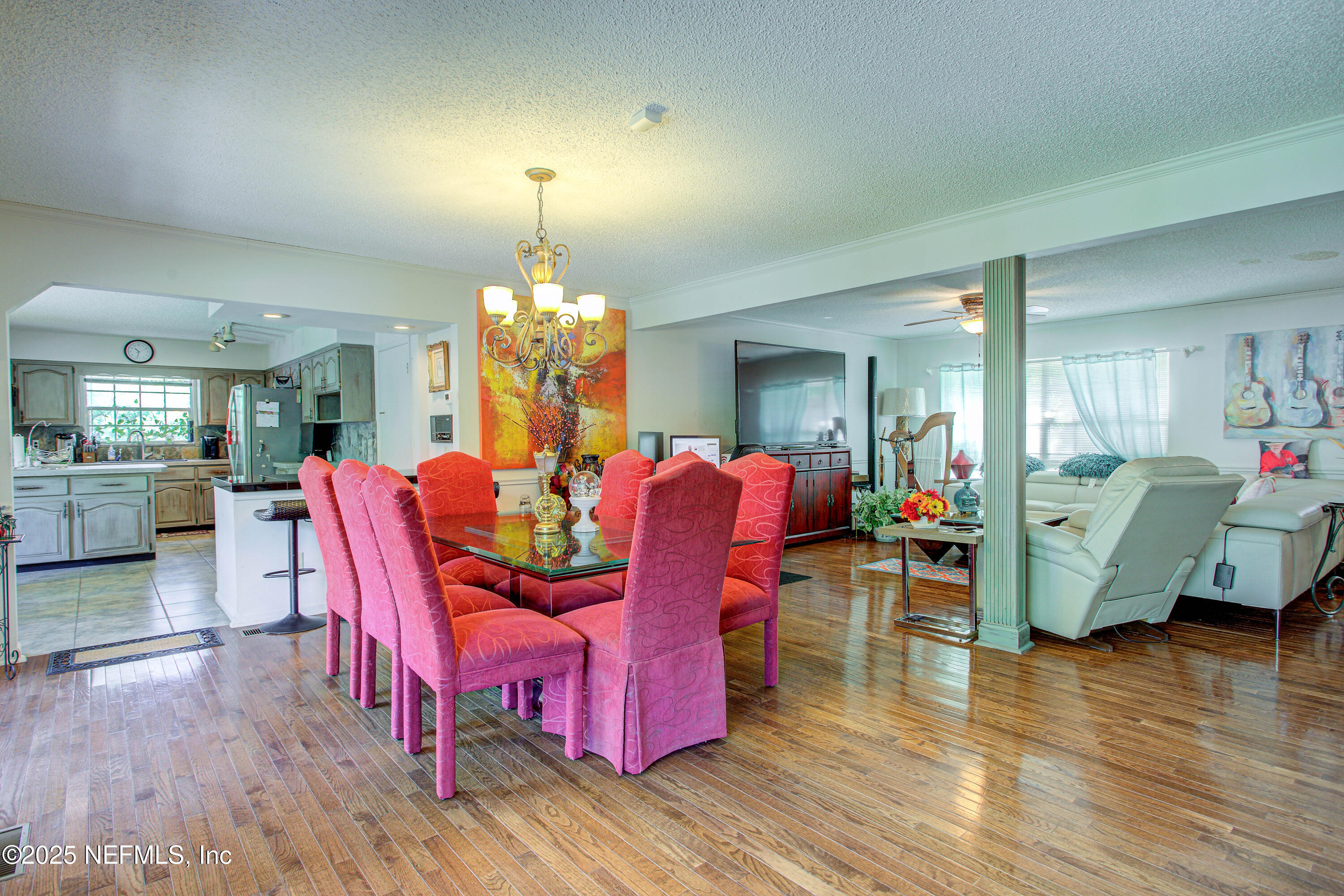4302 Buck Point Road Jacksonville, FL 32210 - Photo 25 of 74 a view of a dining room with furniture and wooden floor