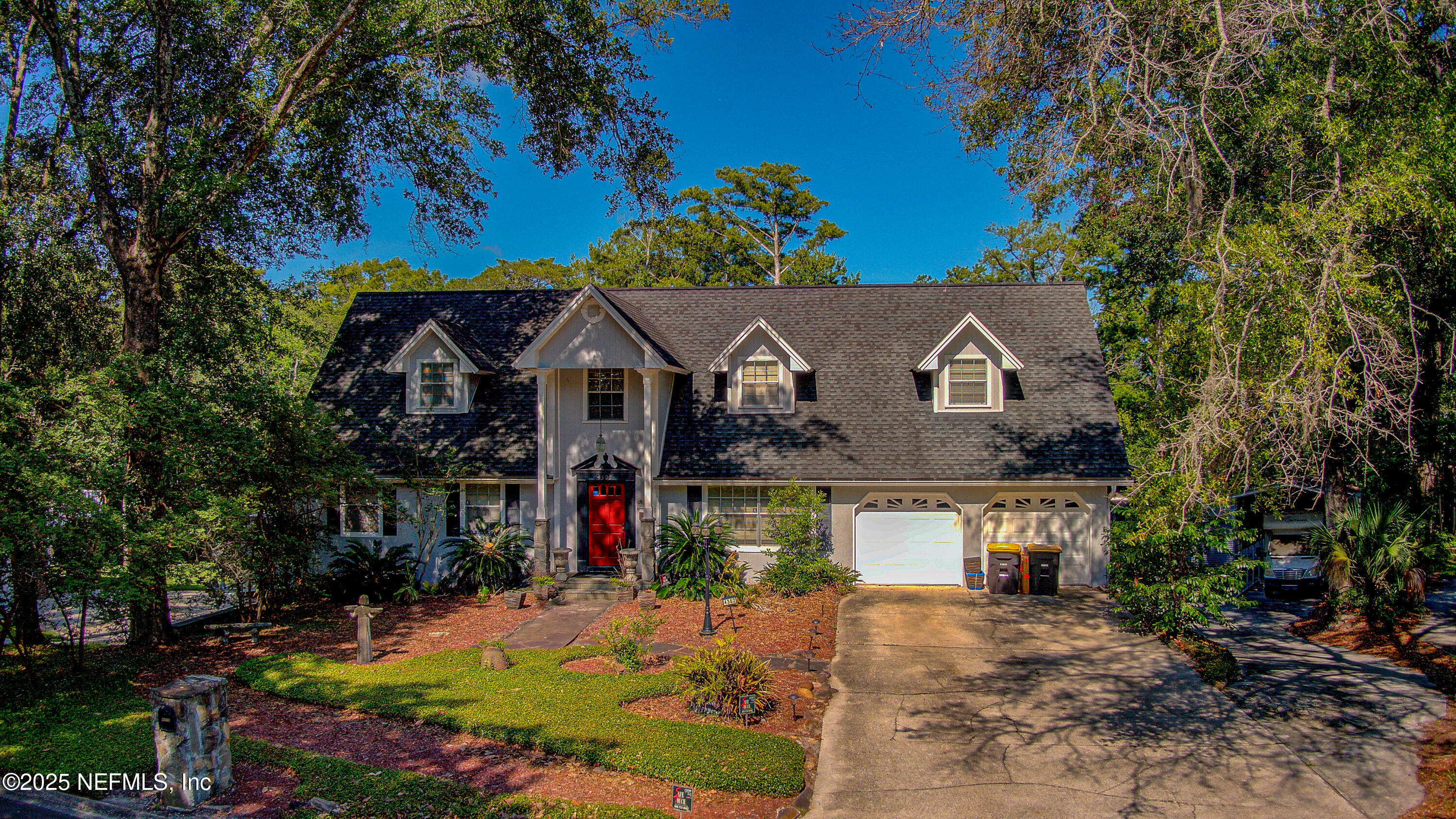 4302 Buck Point Road Jacksonville, FL 32210 - Photo 3 of 74 a view of house with a yard and outdoor seating