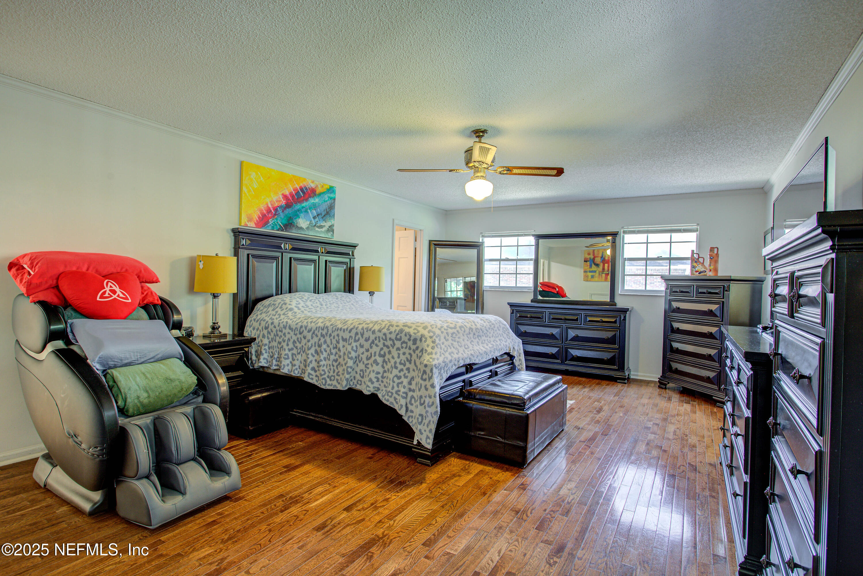 4302 Buck Point Road Jacksonville, FL 32210 - Photo 33 of 74 a bedroom with furniture and a flat screen tv