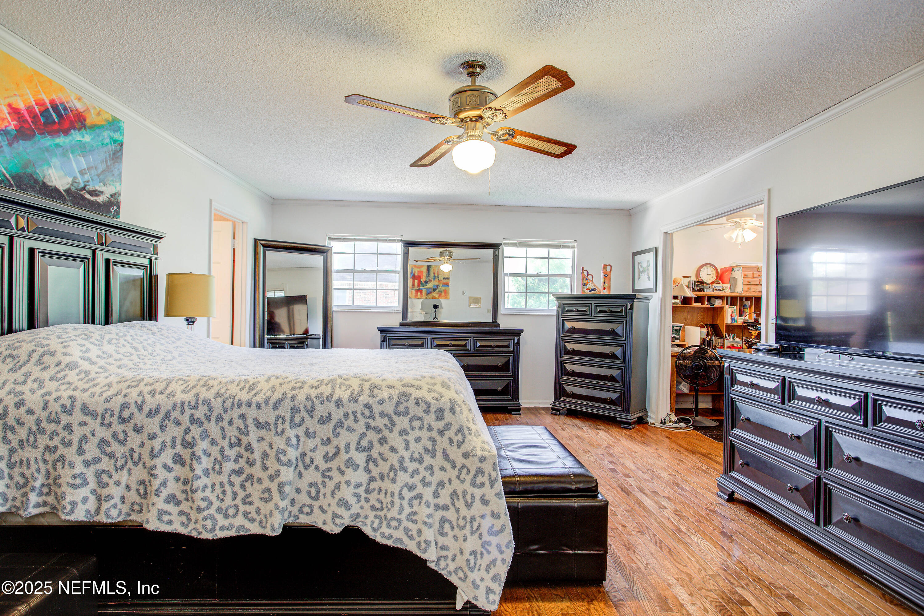 4302 Buck Point Road Jacksonville, FL 32210 - Photo 34 of 74 a bed room with a bed and a television