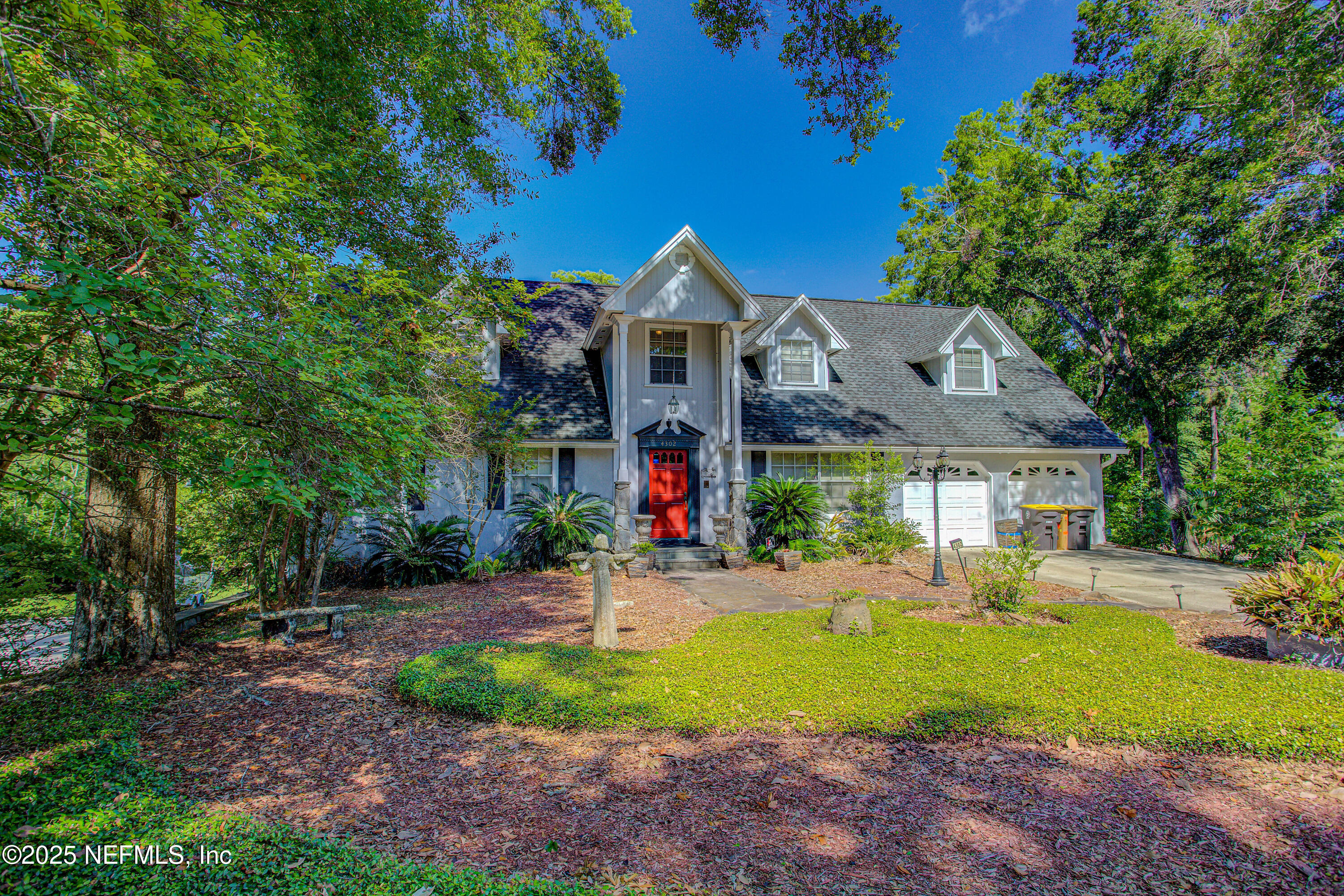 4302 Buck Point Road Jacksonville, FL 32210 - Photo 4 of 74 a front view of house with yard and green space