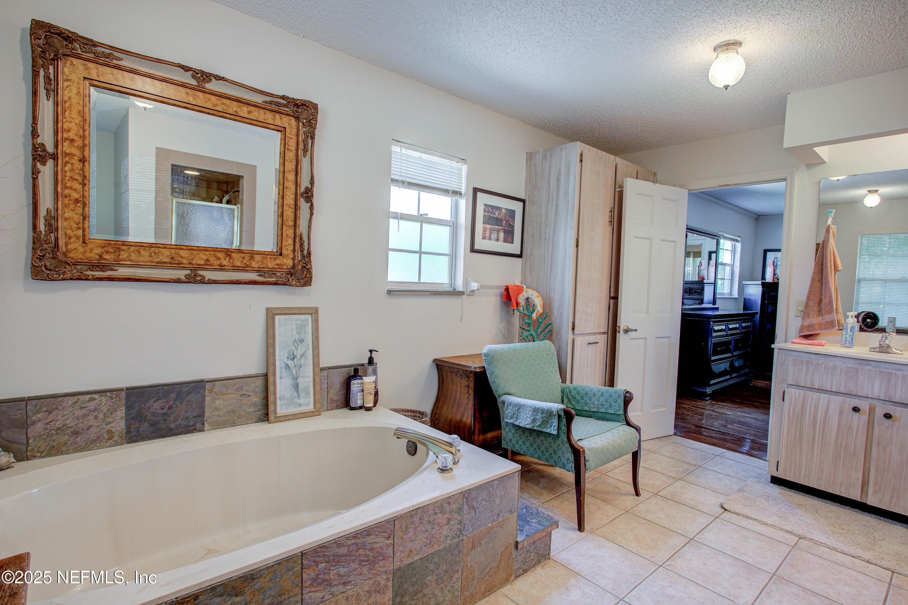 4302 Buck Point Road Jacksonville, FL 32210 - Photo 45 of 74 a living room with furniture and a potted plant