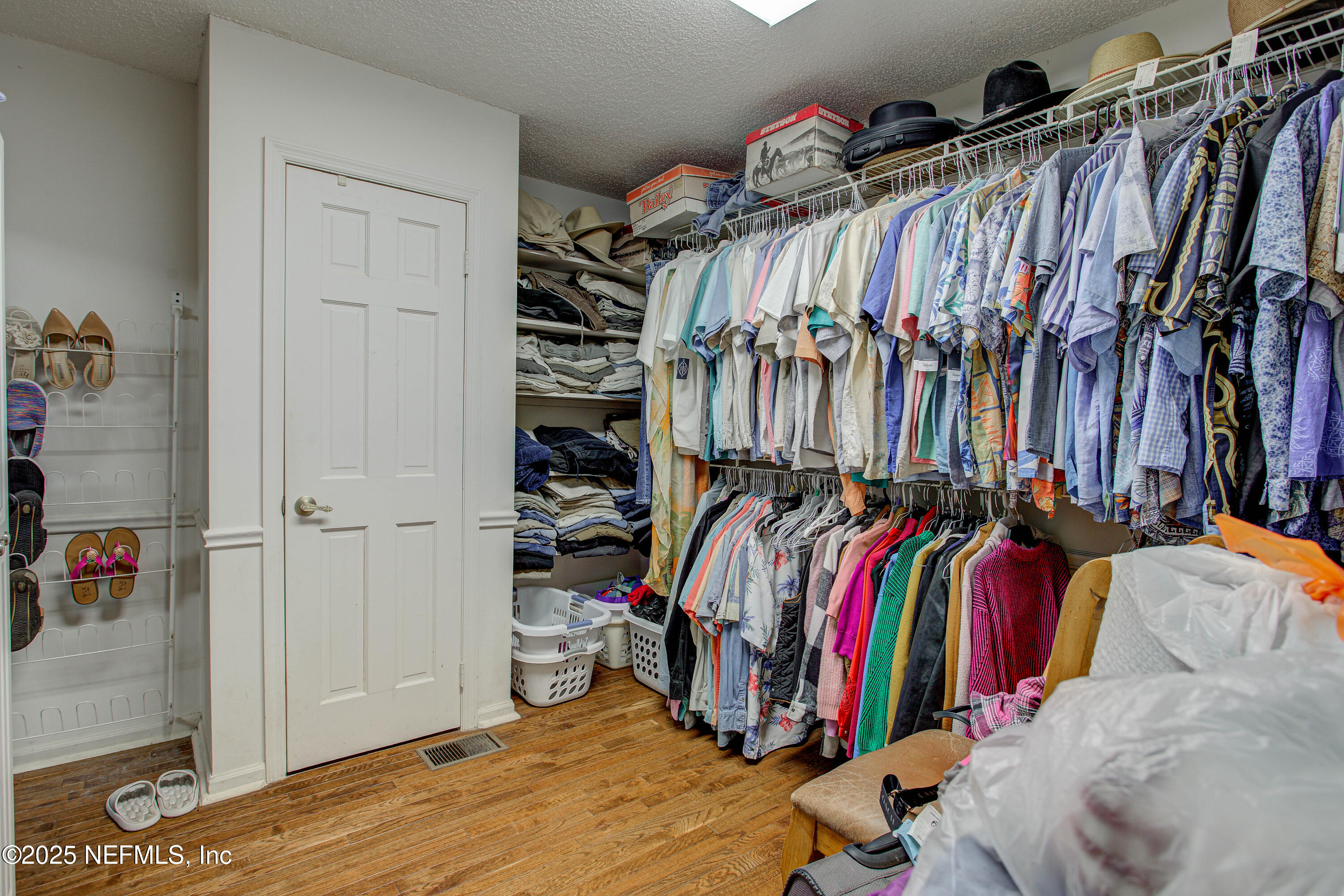 4302 Buck Point Road Jacksonville, FL 32210 - Photo 47 of 74 a view of walk in closet with clothes and shoes