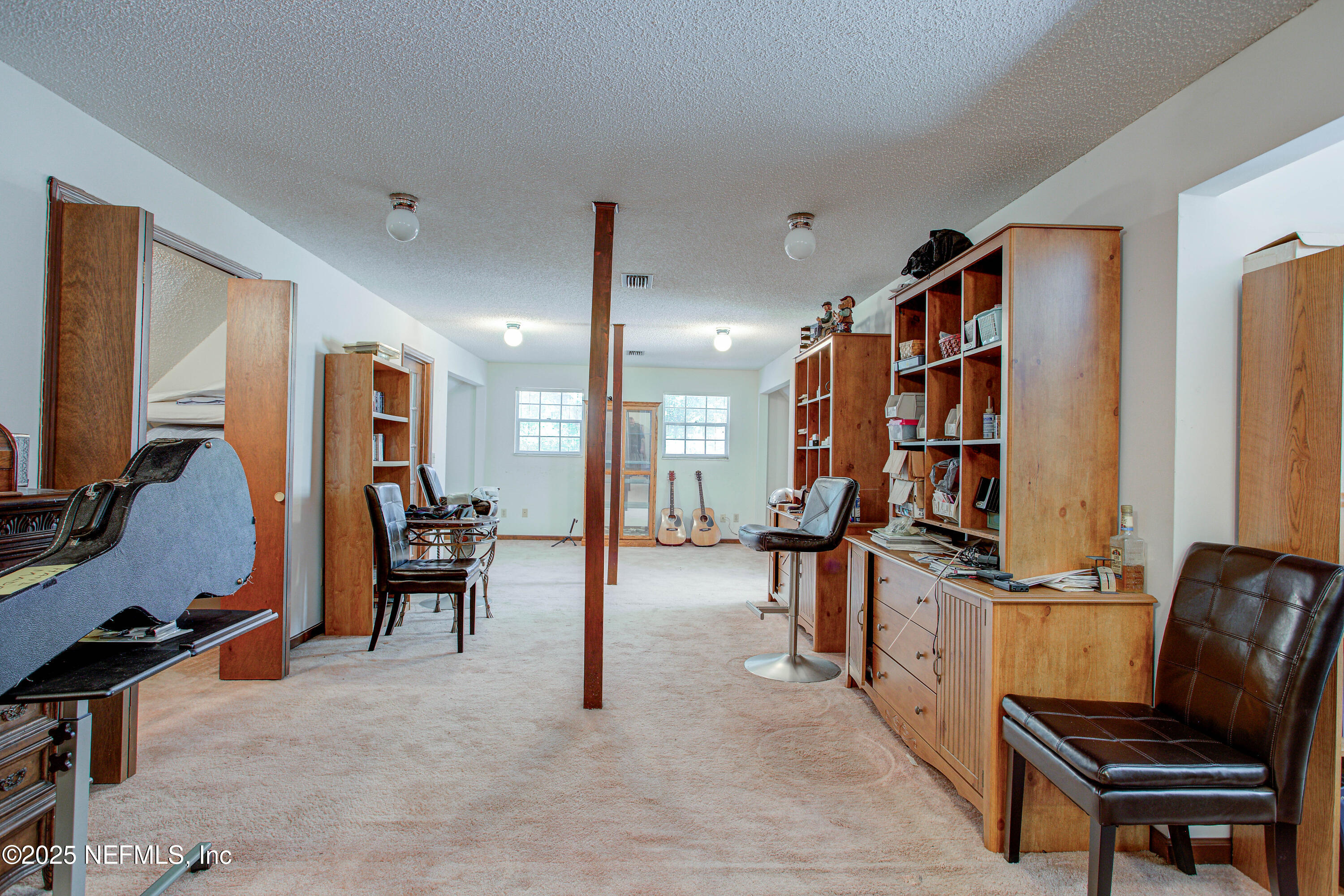 4302 Buck Point Road Jacksonville, FL 32210 - Photo 49 of 74 a living room with furniture a piano and a flat screen tv
