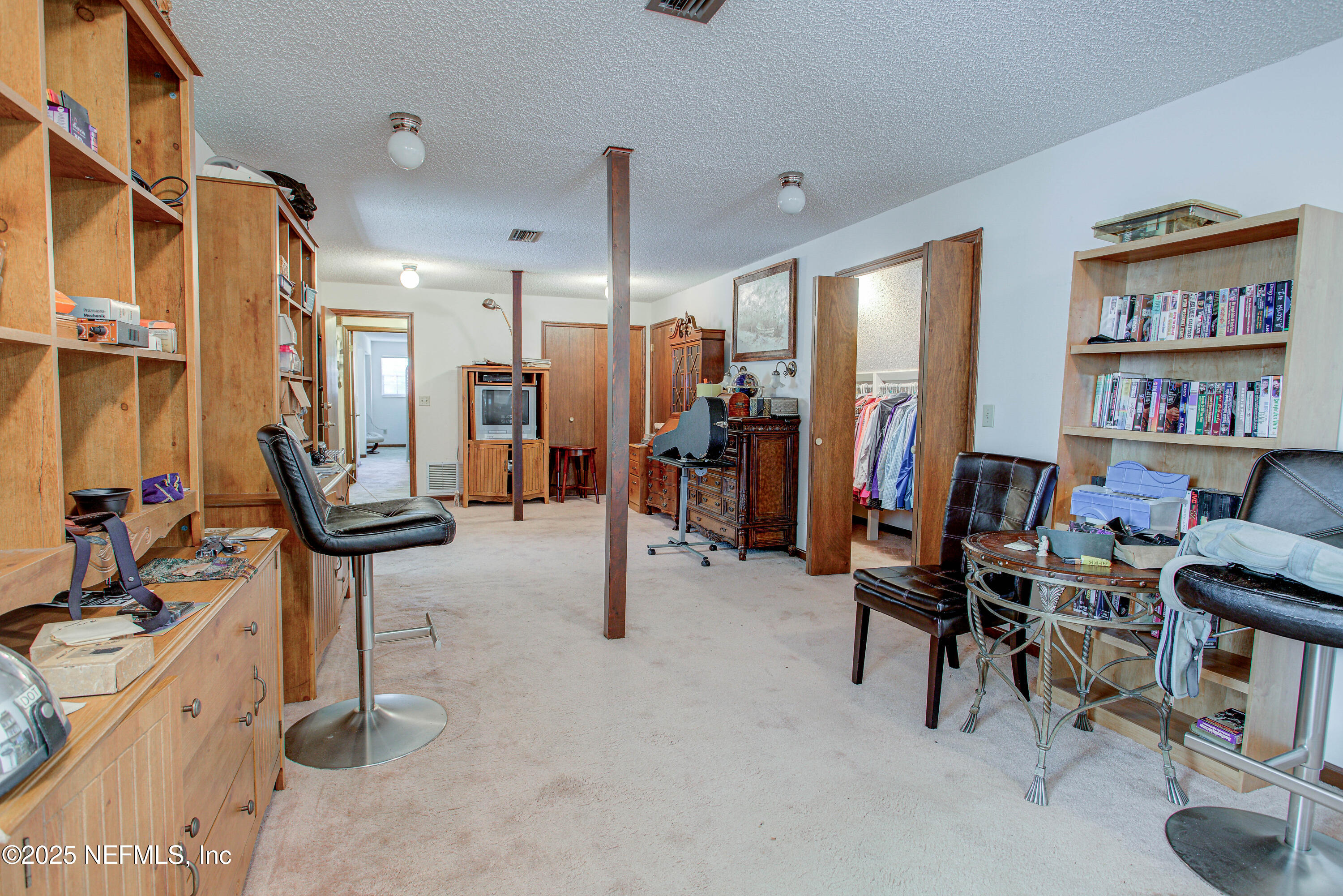 4302 Buck Point Road Jacksonville, FL 32210 - Photo 52 of 74 a view of a livingroom with workspace and a window