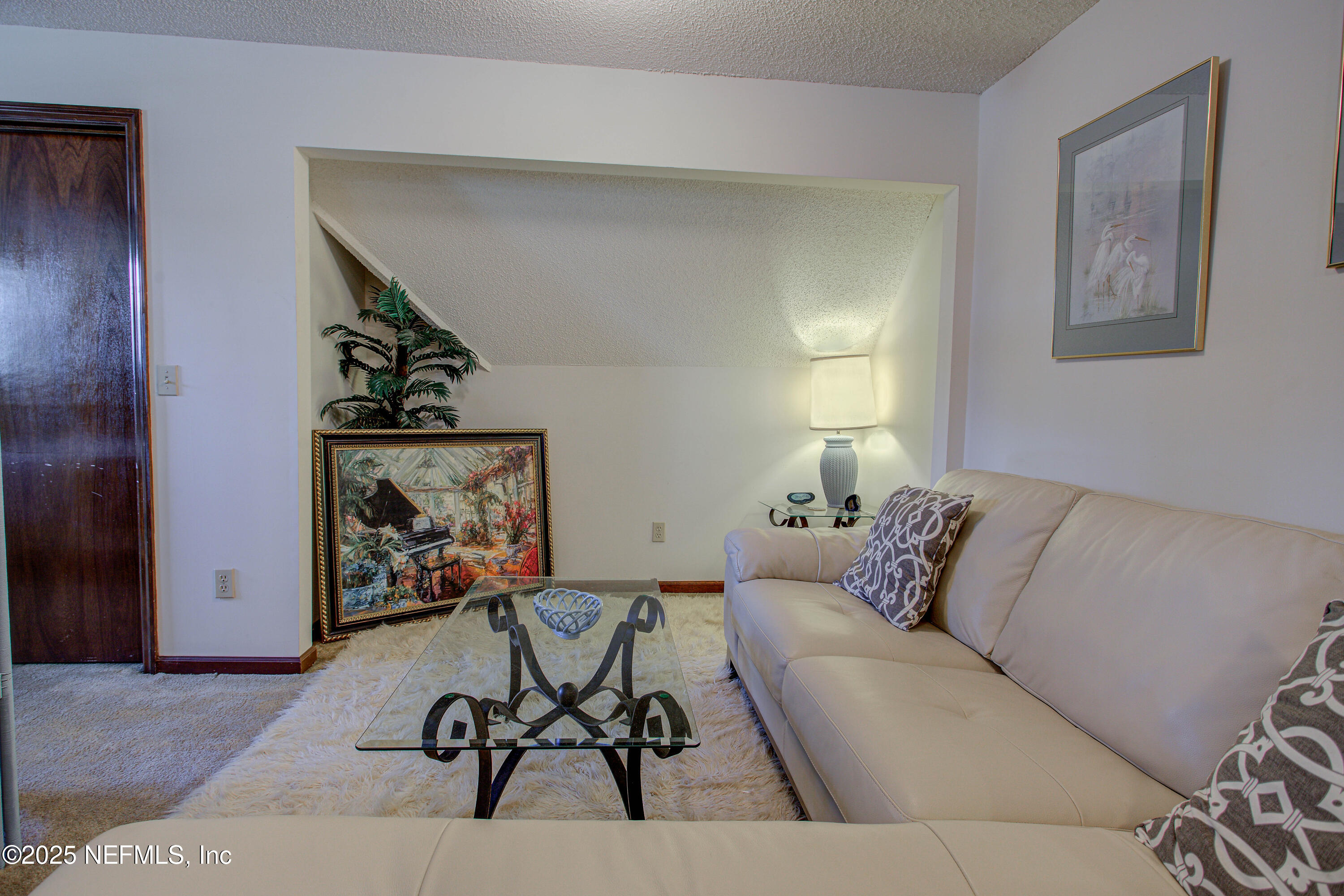 4302 Buck Point Road Jacksonville, FL 32210 - Photo 56 of 74 a living room with furniture and a window