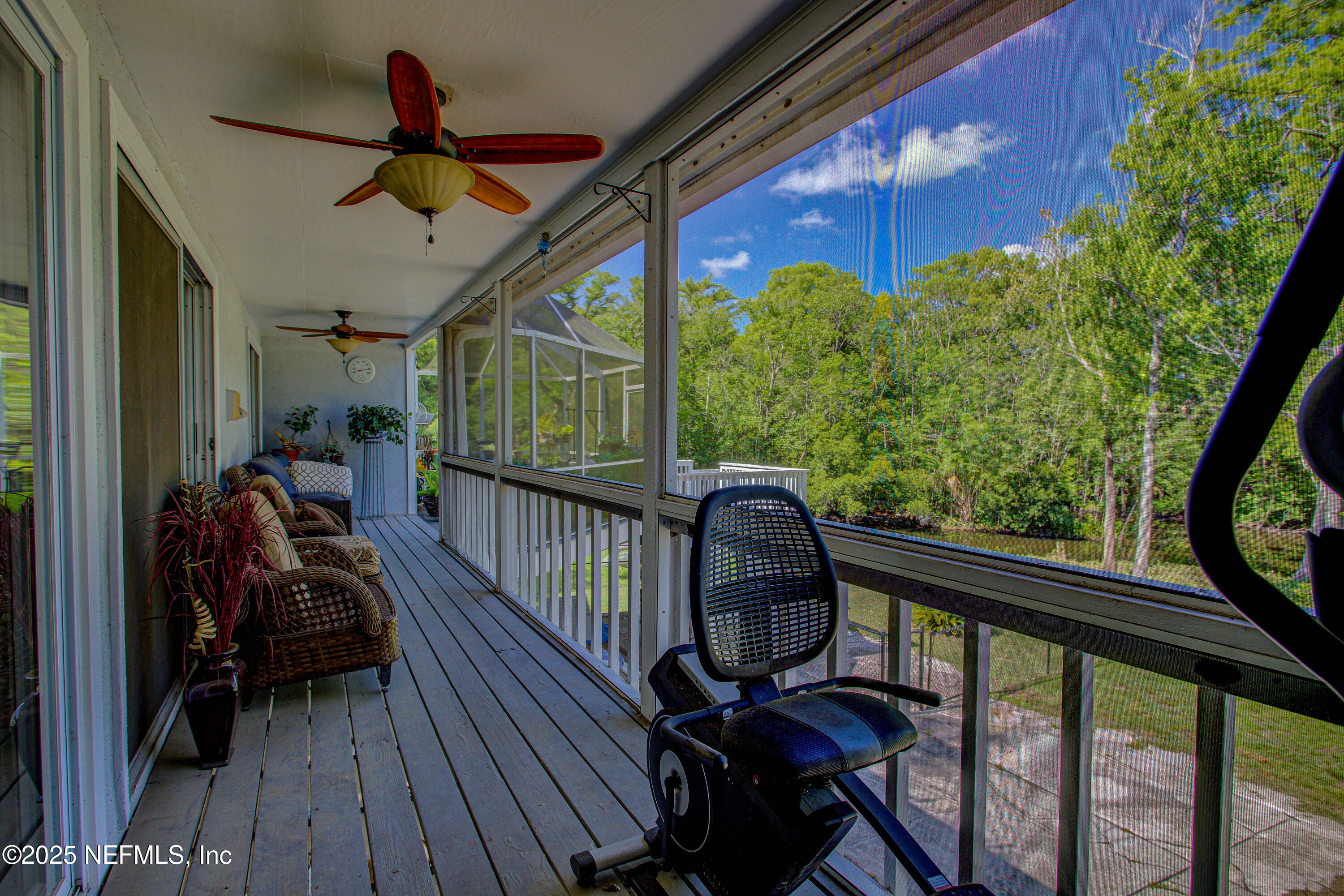 4302 Buck Point Road Jacksonville, FL 32210 - Photo 61 of 74 a view of a porch with furniture and a yard