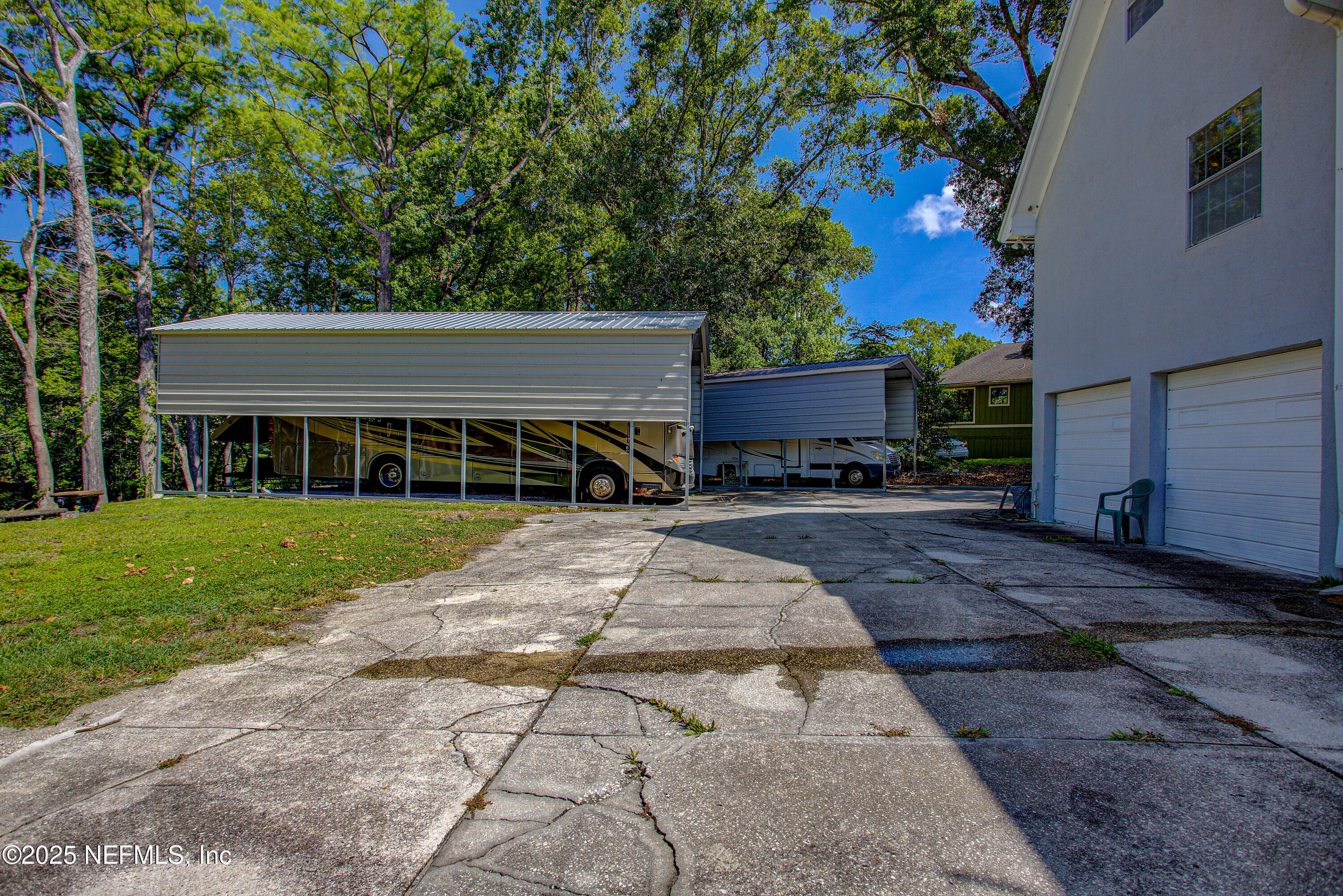 4302 Buck Point Road Jacksonville, FL 32210 - Photo 69 of 74 a view of a house with a yard