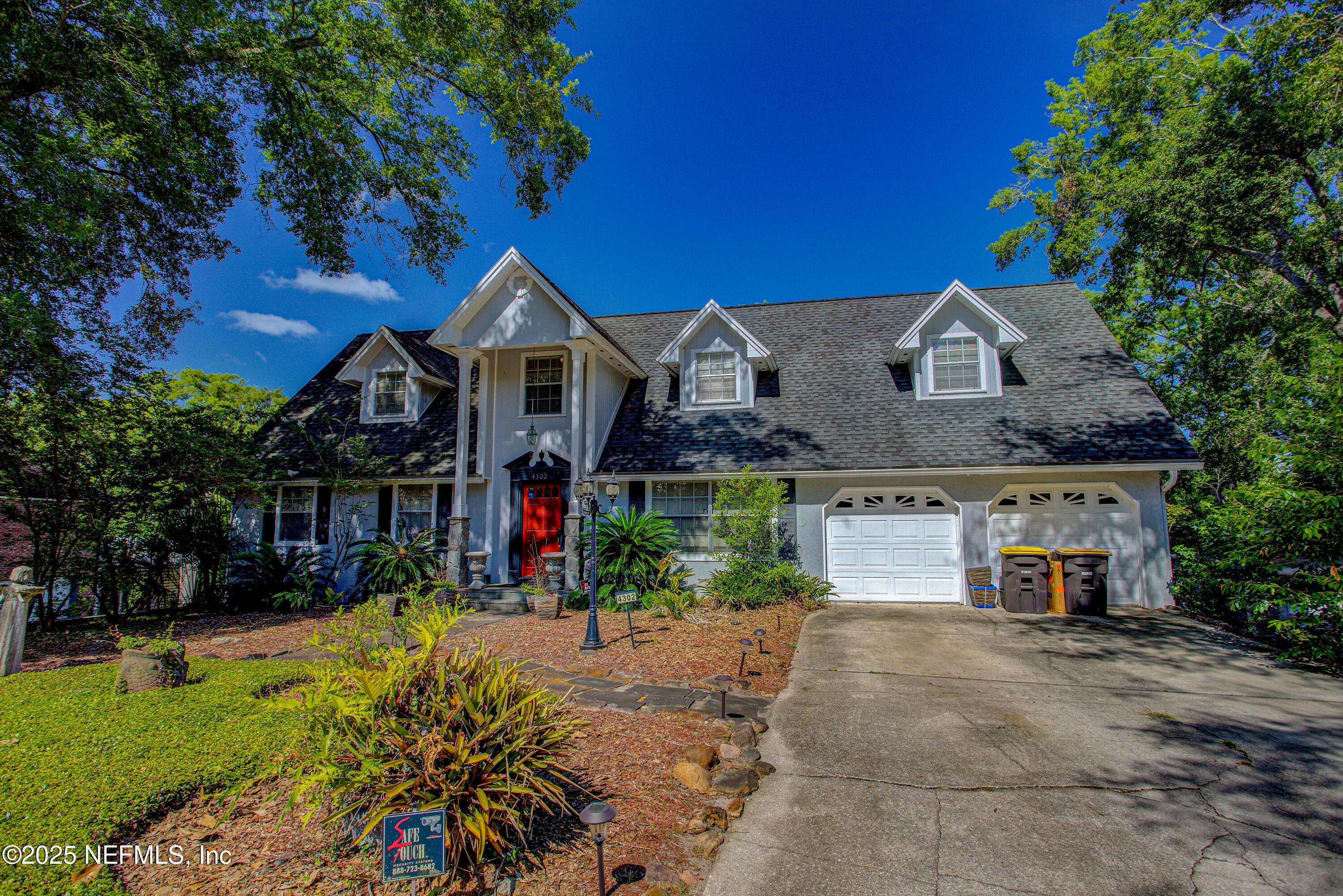 4302 Buck Point Road Jacksonville, FL 32210 - Photo 7 of 74 a front view of a house with a yard