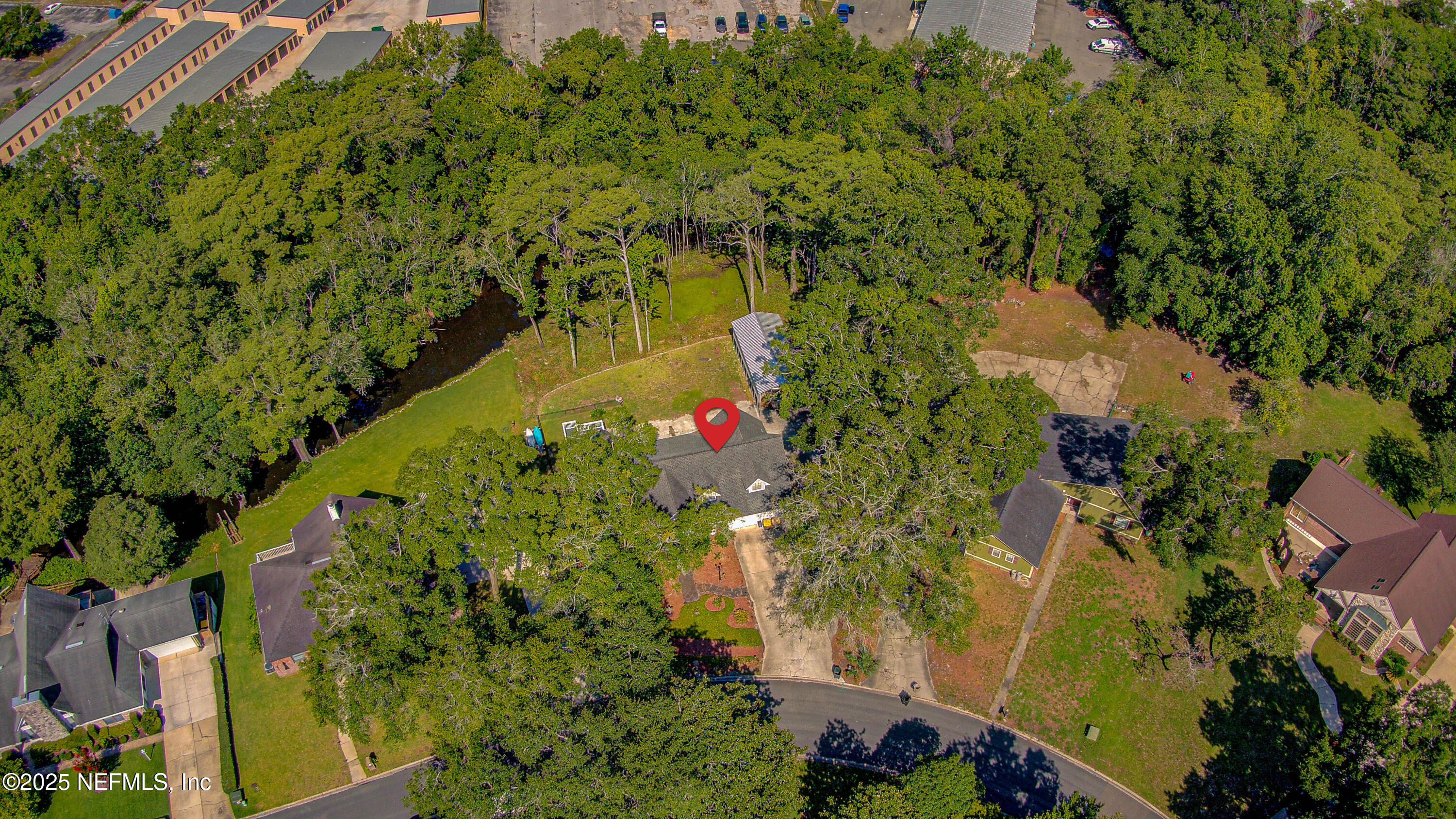 4302 Buck Point Road Jacksonville, FL 32210 - Photo 10 of 74 an aerial view of residential house with yard and outdoor seating