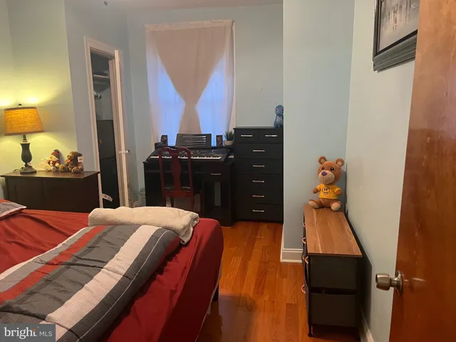 a bed room with a bed and a television