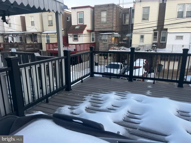 a view of balcony with wooden floor