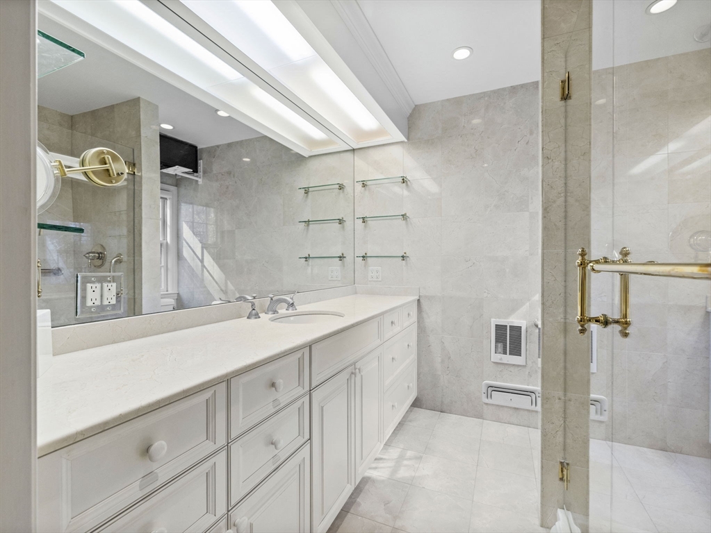 14 Colgate Road Wellesley, MA 02482 - Photo 13 of 19 a bathroom with a double vanity sink mirror and shower
