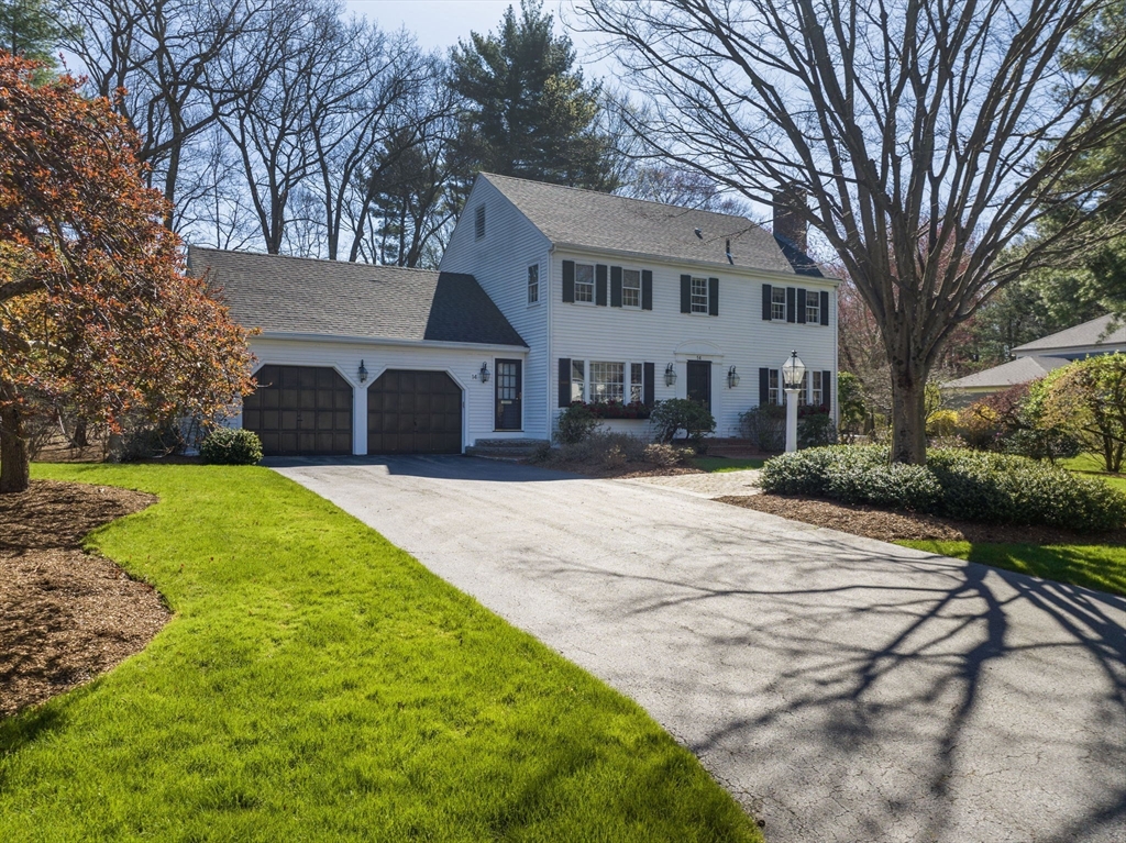 14 Colgate Road Wellesley, MA 02482 - Photo 19 of 19 a front view of a house with a yard and garage