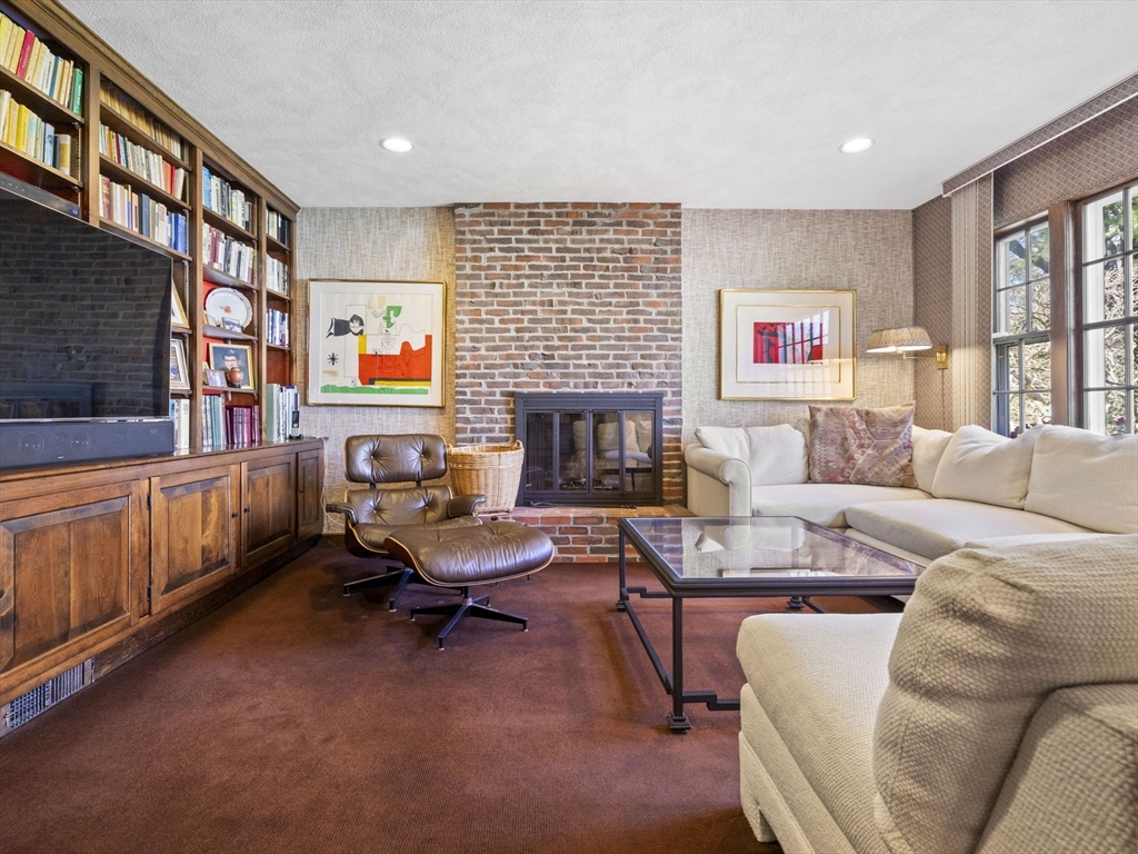 14 Colgate Road Wellesley, MA 02482 - Photo 10 of 19 a living room with furniture and a fireplace
