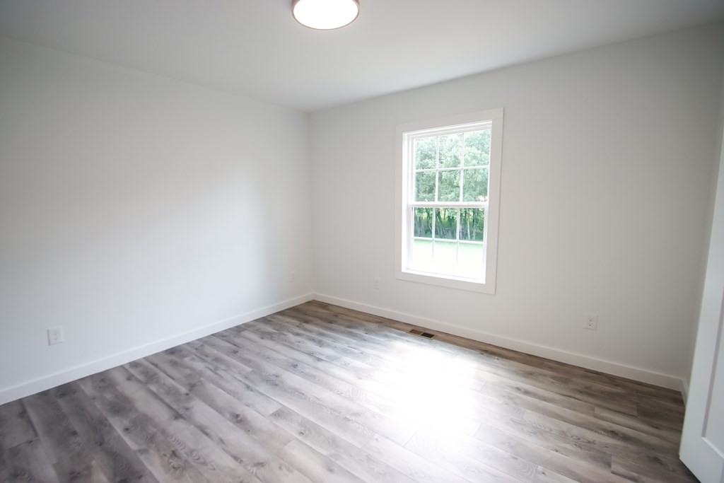 156 Will Thompson Road Sparta, TN 38583 - Photo 14 of 20 wooden floor in an empty room with a window