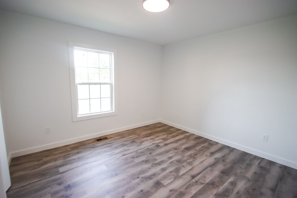 156 Will Thompson Road Sparta, TN 38583 - Photo 16 of 20 an empty room with wooden floor and windows