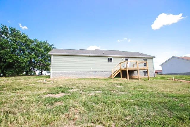 a view of a big yard with an outdoor space