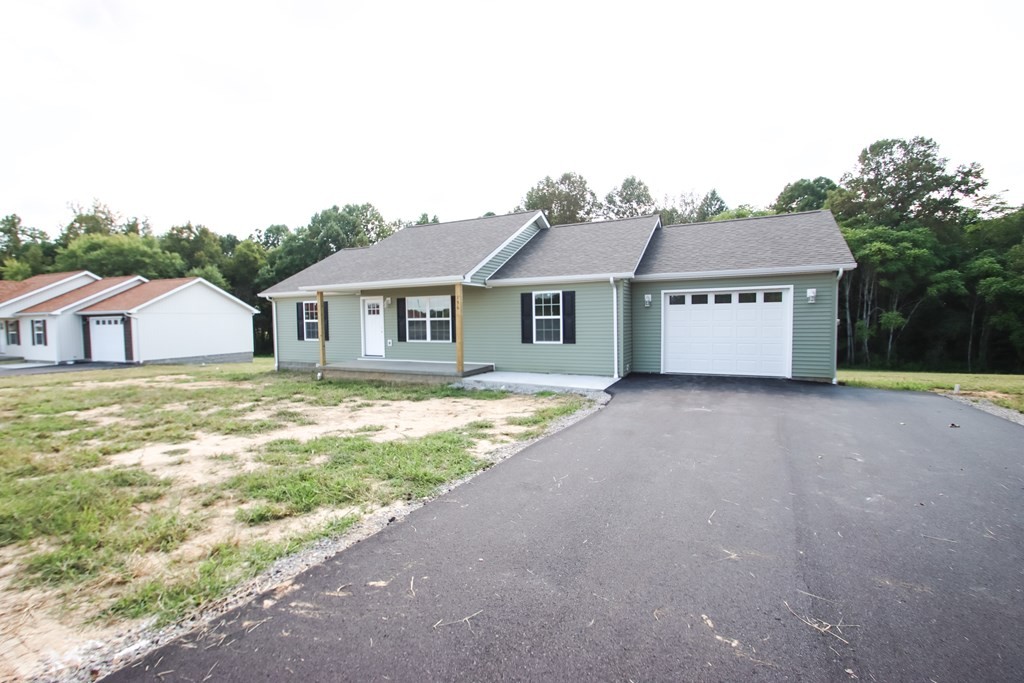 156 Will Thompson Road Sparta, TN 38583 - Photo 2 of 20 a house with huge green field in front of it