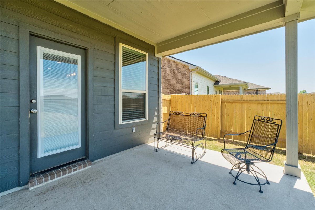 5408 Vanner Path Georgetown, TX 78626 - Photo 30 of 34 Covered patio featuring a concrete slab and painted siding exterior