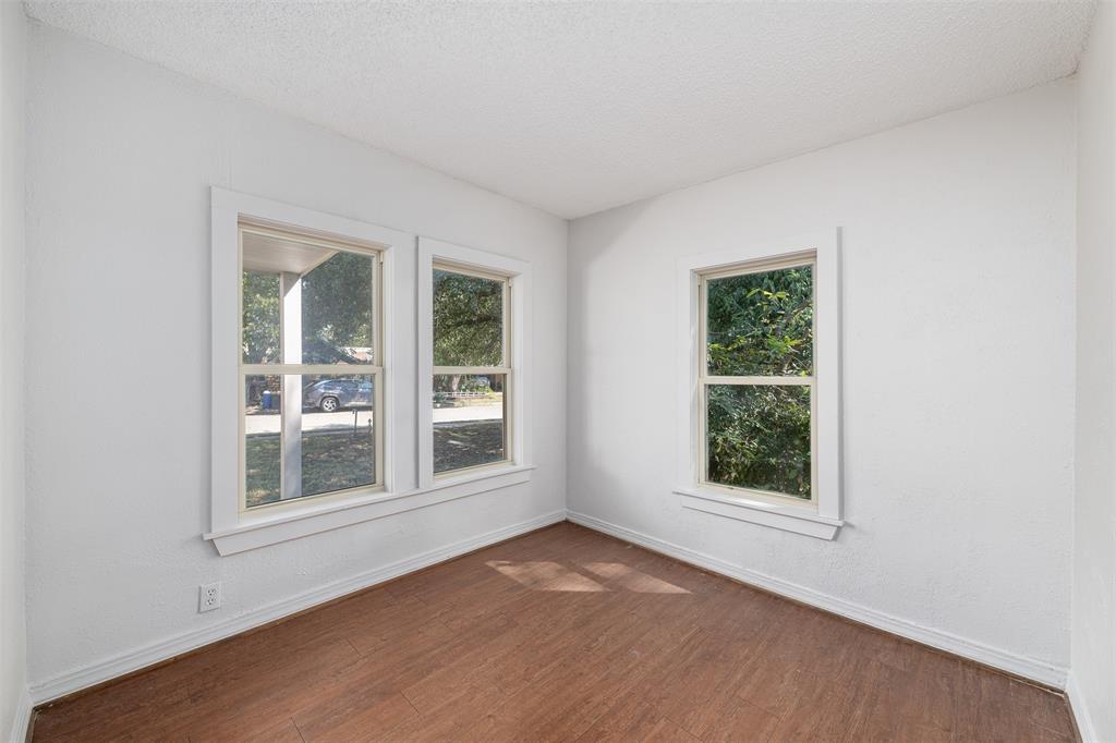 102 San Saba Avenue Benbrook, TX 76126 - Photo 12 of 25 a view of an empty room with a window