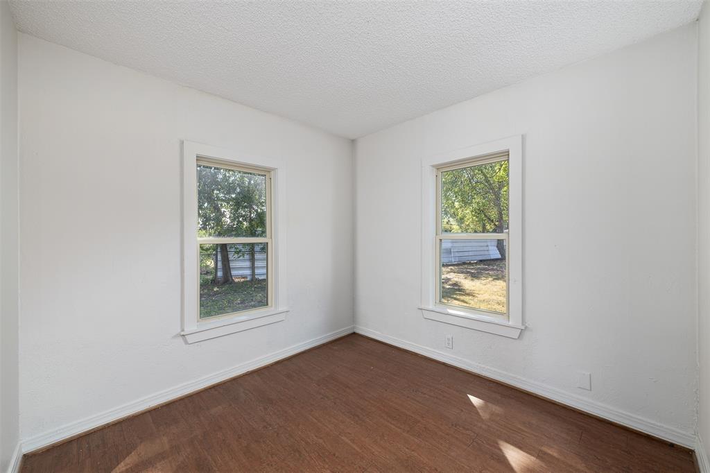 102 San Saba Avenue Benbrook, TX 76126 - Photo 15 of 25 an empty room with windows