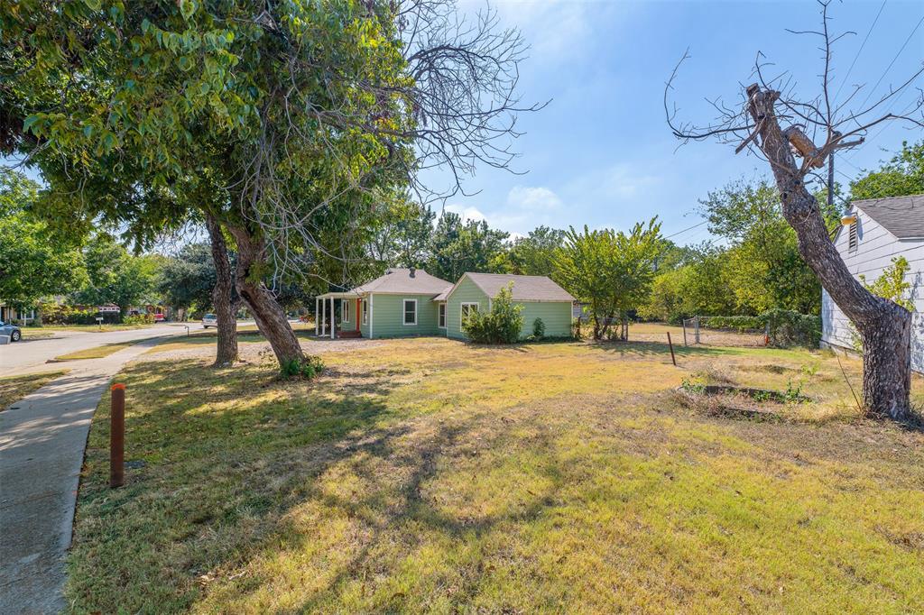 102 San Saba Avenue Benbrook, TX 76126 - Photo 21 of 25 a house with trees in front of it