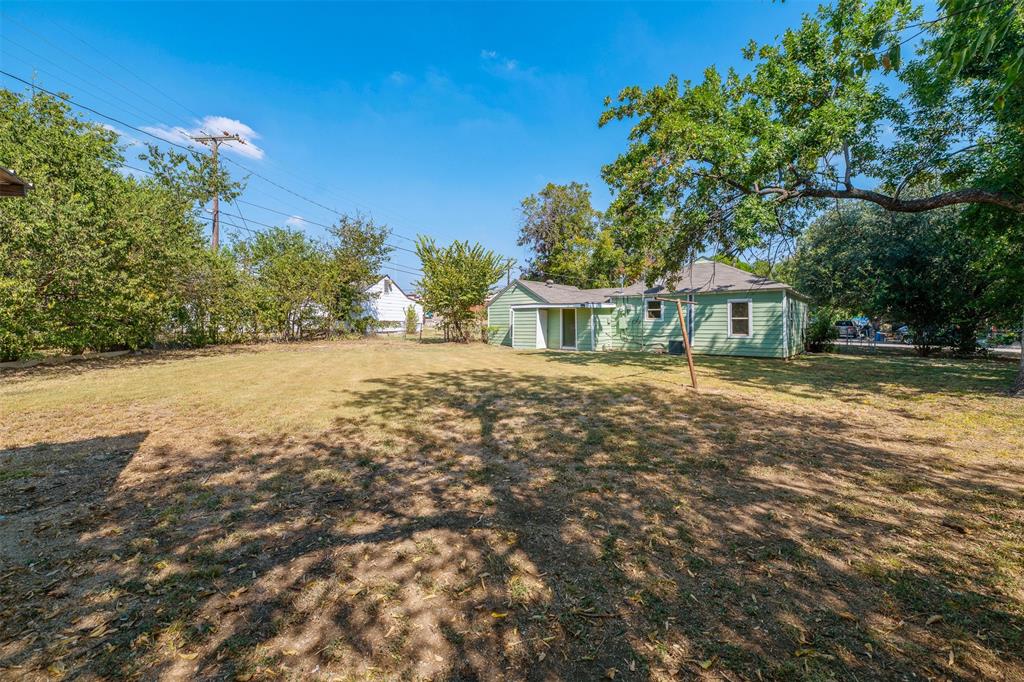 102 San Saba Avenue Benbrook, TX 76126 - Photo 23 of 25 a view of a house with a yard