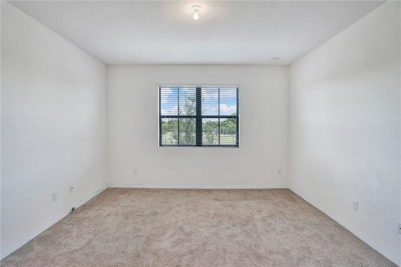 3313 Northwest 11th Avenue Pompano Beach, FL 33064 - Photo 13 of 20 an empty room with windows