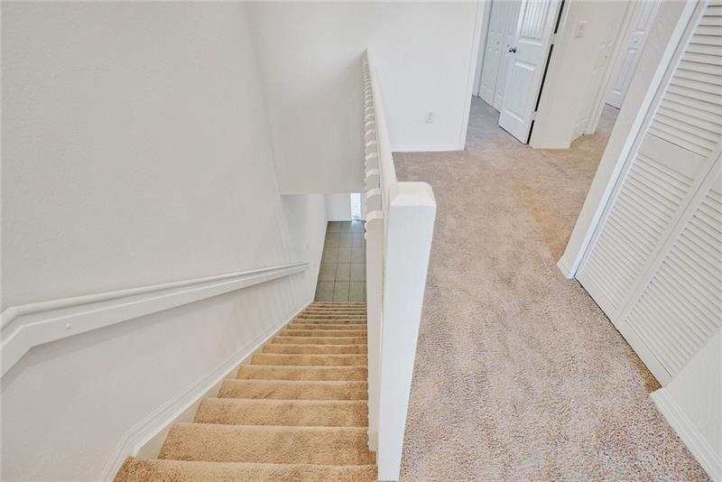 3313 Northwest 11th Avenue Pompano Beach, FL 33064 - Photo 10 of 20 a view of staircase with white walls and white door
