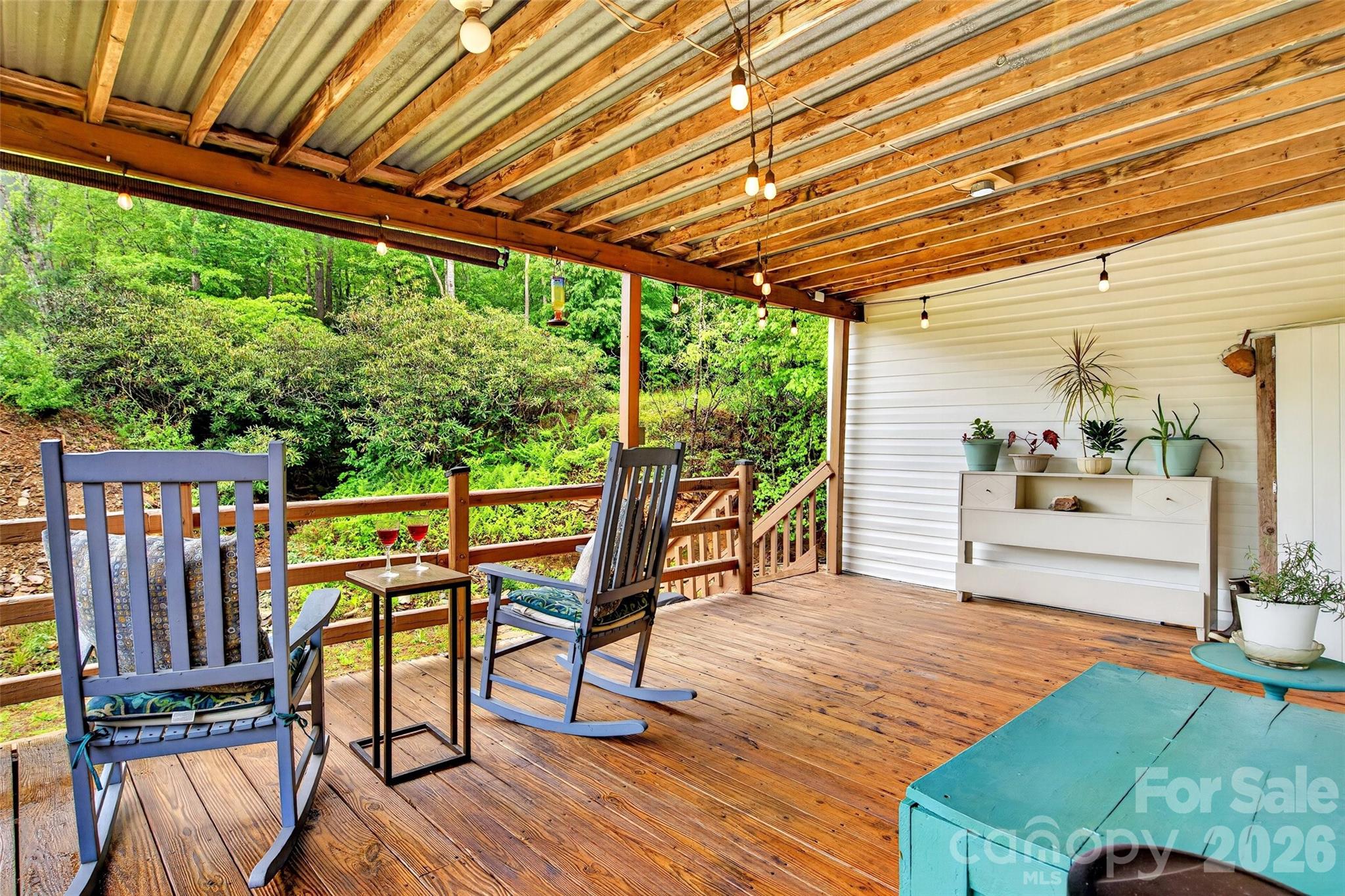 227 Locust Cove Road Marion, NC 28752 - Photo 22 of 34 a patio with glass top table and chairs