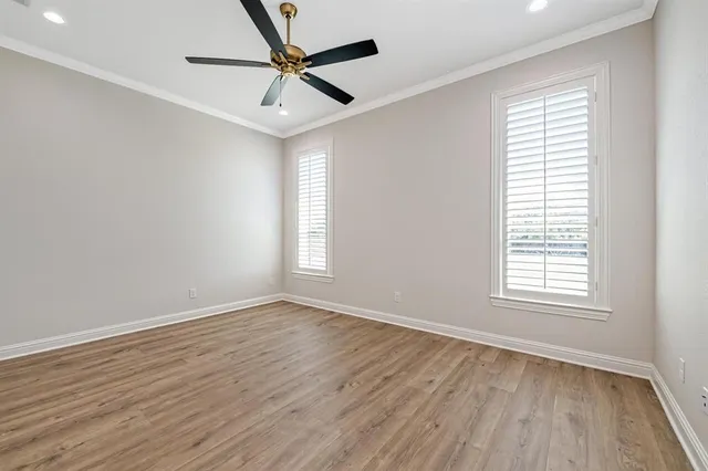 a bathroom with a granite countertop sink a toilet a mirror and shower