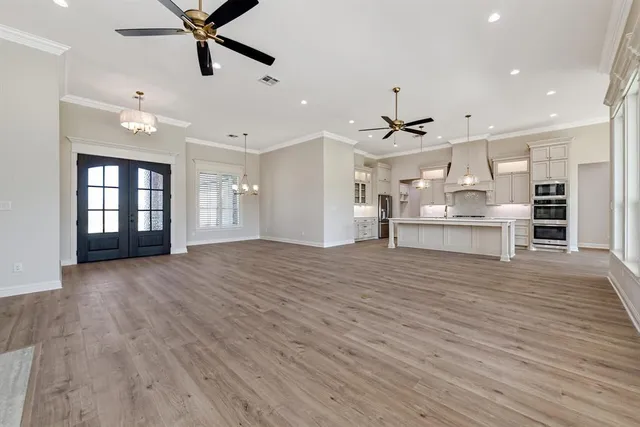 a view of a kitchen with a sink and a window