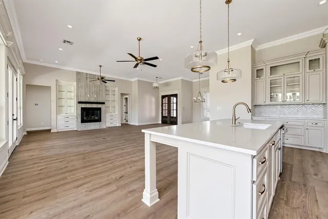 a view of a hall with a floor to ceiling window and stairs