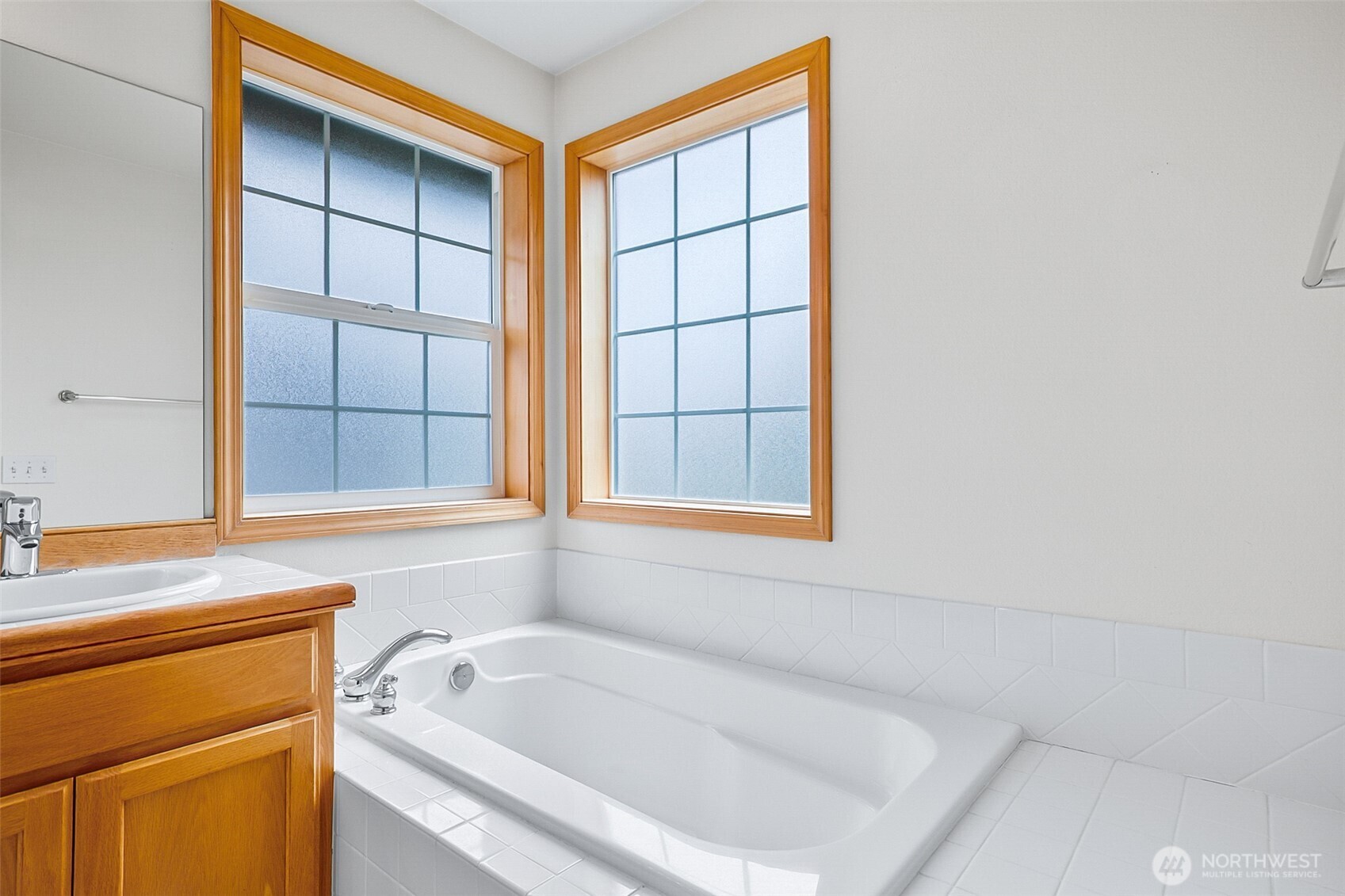 18410 11th Drive Southeast Bothell, WA 98012 - Photo 34 of 40 a bathroom with a bathtub and window