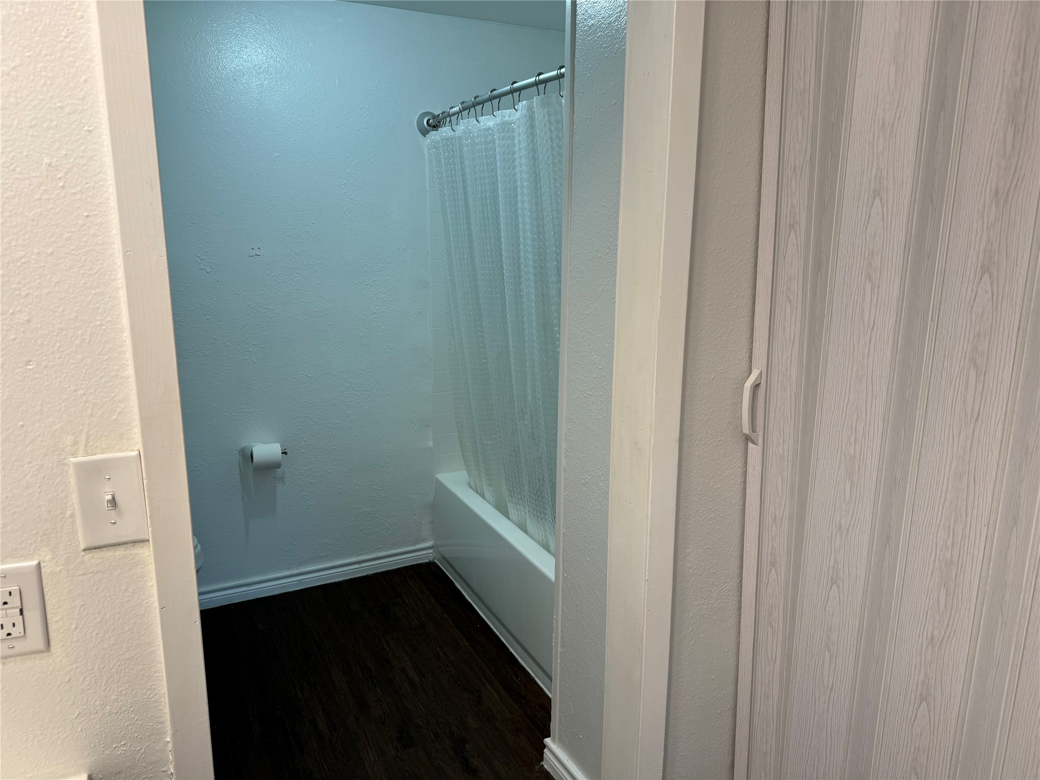 1221 Houston Street, Unit 1 Rosenberg, TX 77471 - Photo 9 of 11 a bathroom with a shower and a door