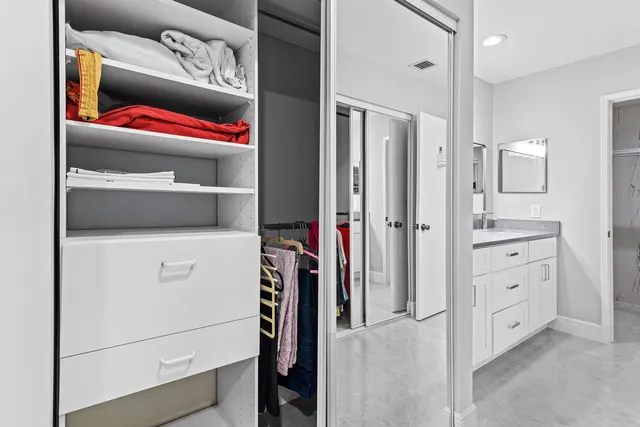a utility room with cabinets washer and dryer