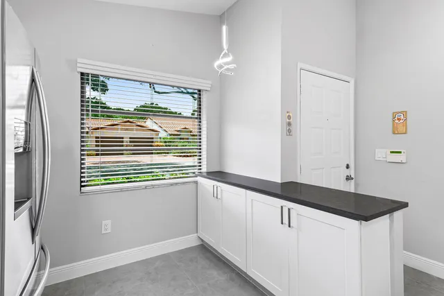a kitchen with a sink and a window