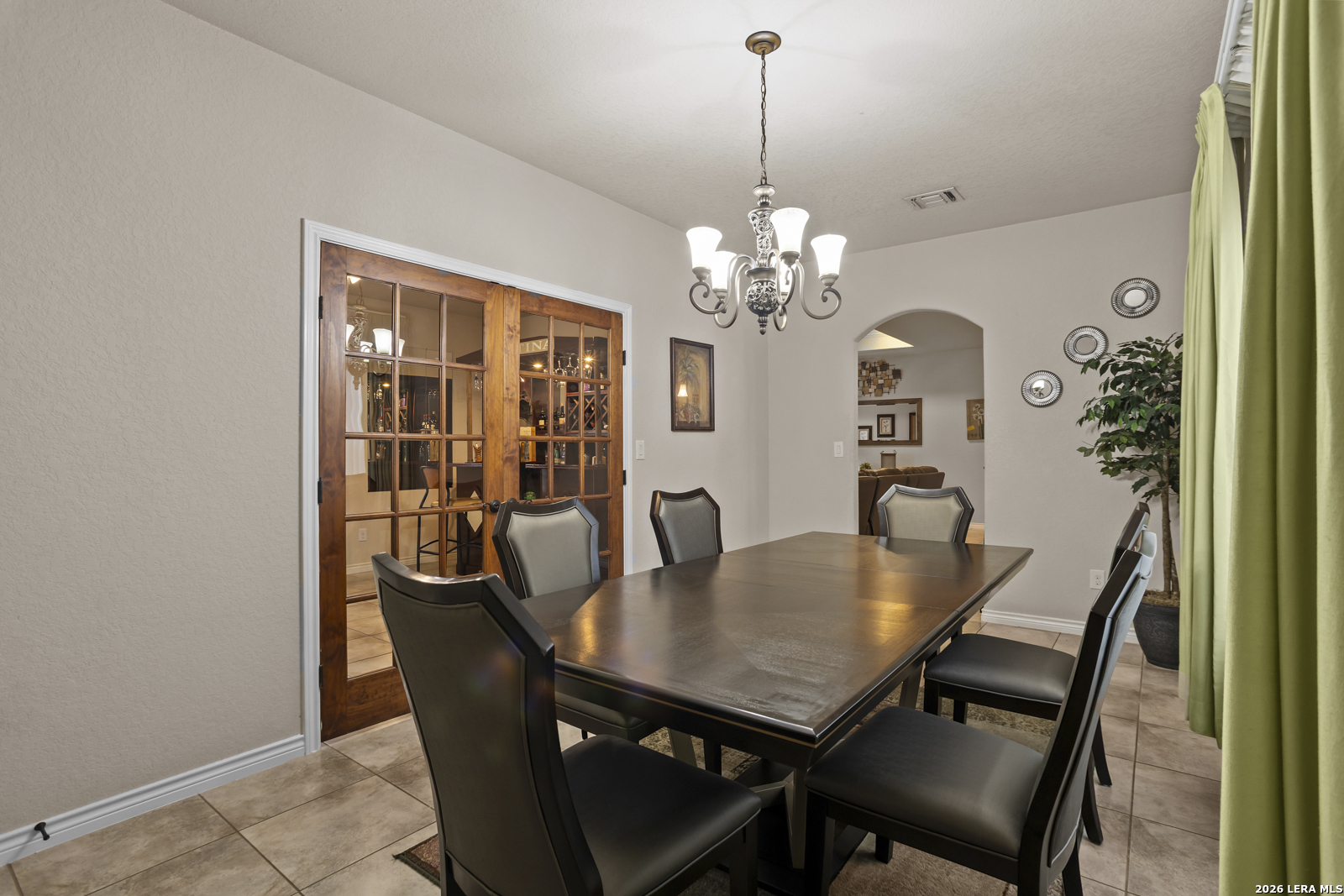 500 Wagon Train Road La Vernia, TX 78121 - Photo 16 of 44 a view of a dining room with furniture and chandelier