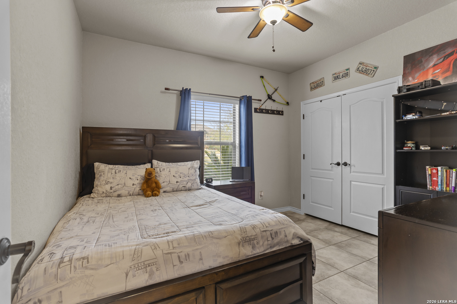 500 Wagon Train Road La Vernia, TX 78121 - Photo 24 of 44 a spacious bedroom with a bed and a chandelier