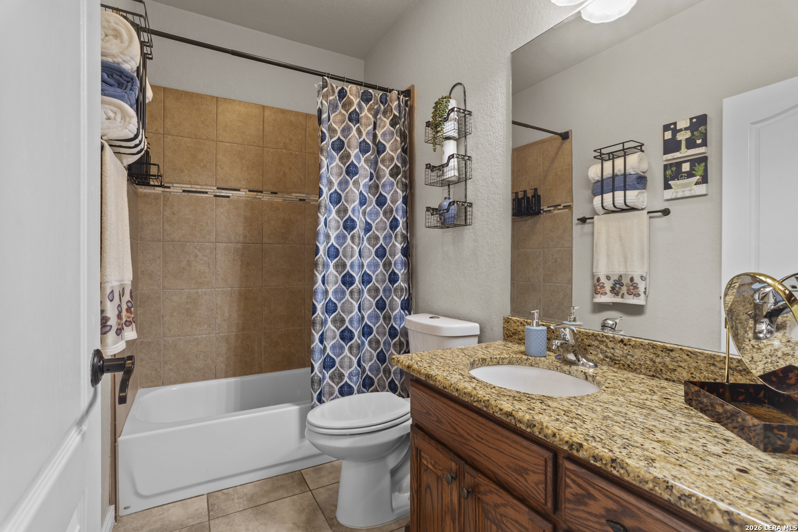 500 Wagon Train Road La Vernia, TX 78121 - Photo 25 of 44 a bathroom with a granite countertop sink toilet and shower
