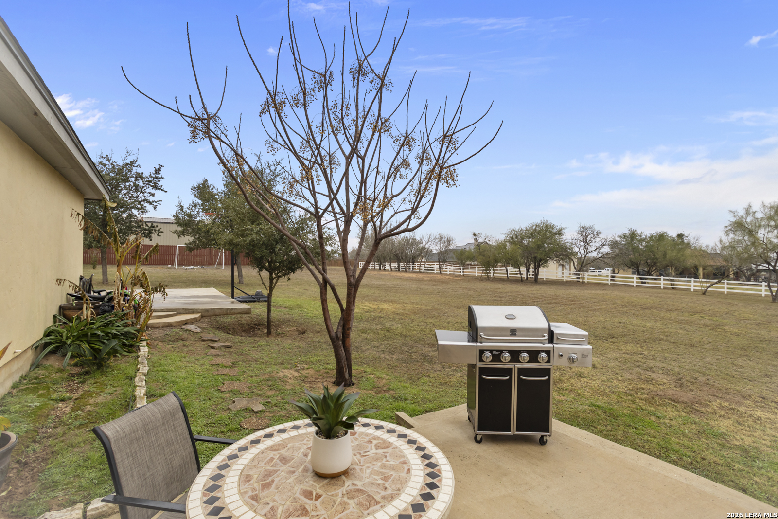500 Wagon Train Road La Vernia, TX 78121 - Photo 31 of 44 a backyard of a house with table and chairs