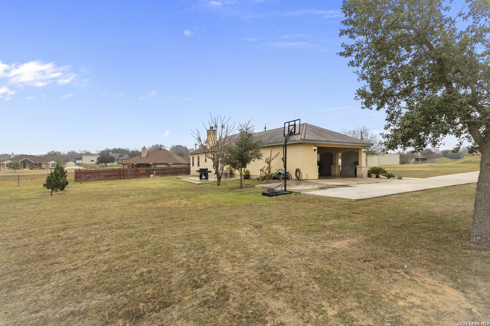 500 Wagon Train Road La Vernia, TX 78121 - Photo 33 of 44 a front view of a house with a yard and lake view