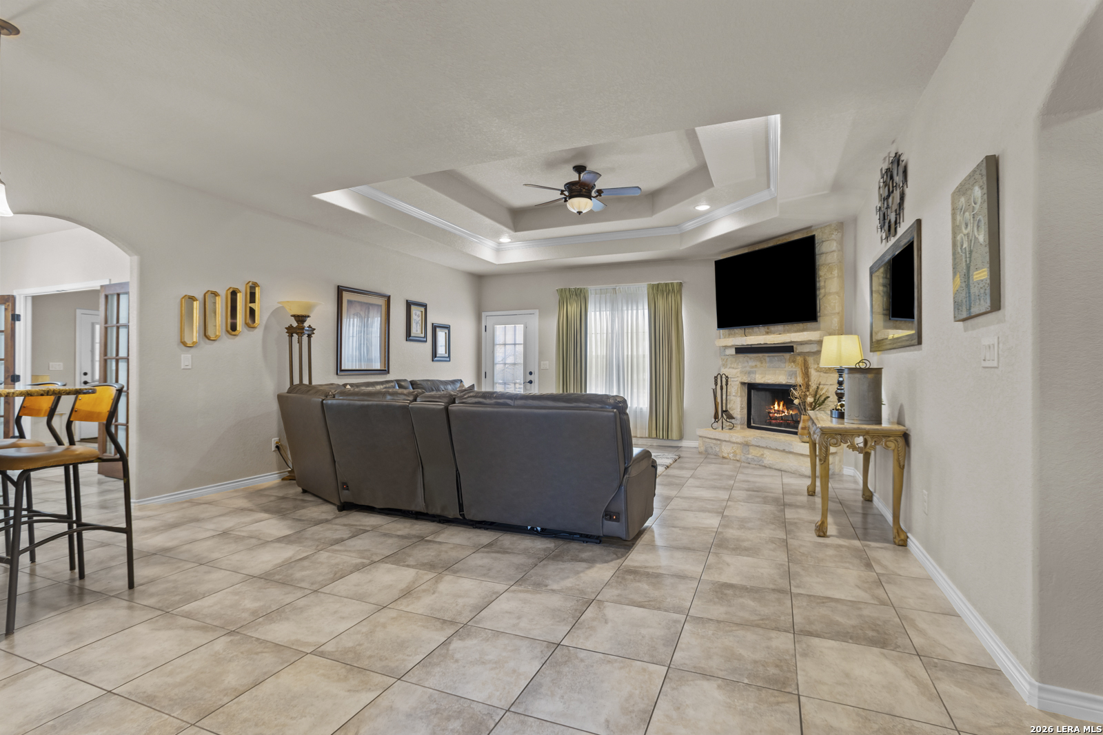 500 Wagon Train Road La Vernia, TX 78121 - Photo 6 of 44 a living room with furniture and a flat screen tv