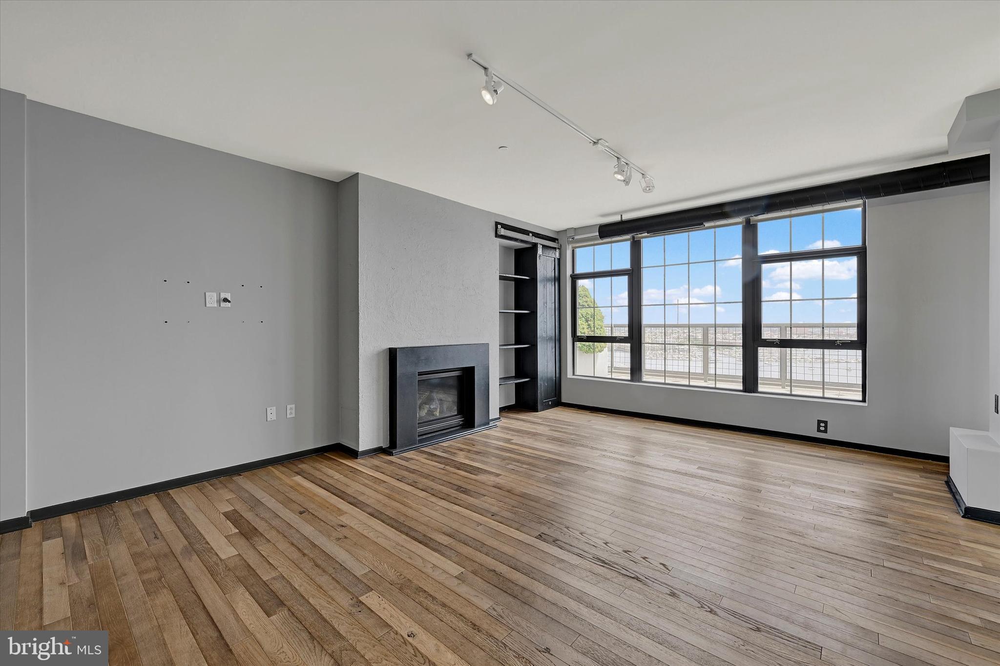1200 Steuart Street, Unit 1913 Baltimore, MD 21230 - Photo 8 of 94 Sleek fireplace wall.