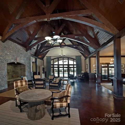 a dining room with furniture wooden floor and a rug