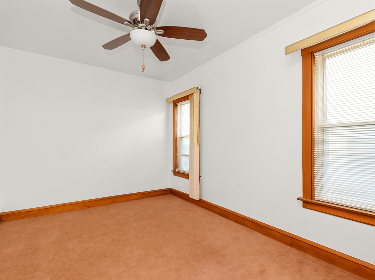 1413 North Long Avenue Chicago, IL 60651 - Photo 8 of 16 an empty room with windows and fan