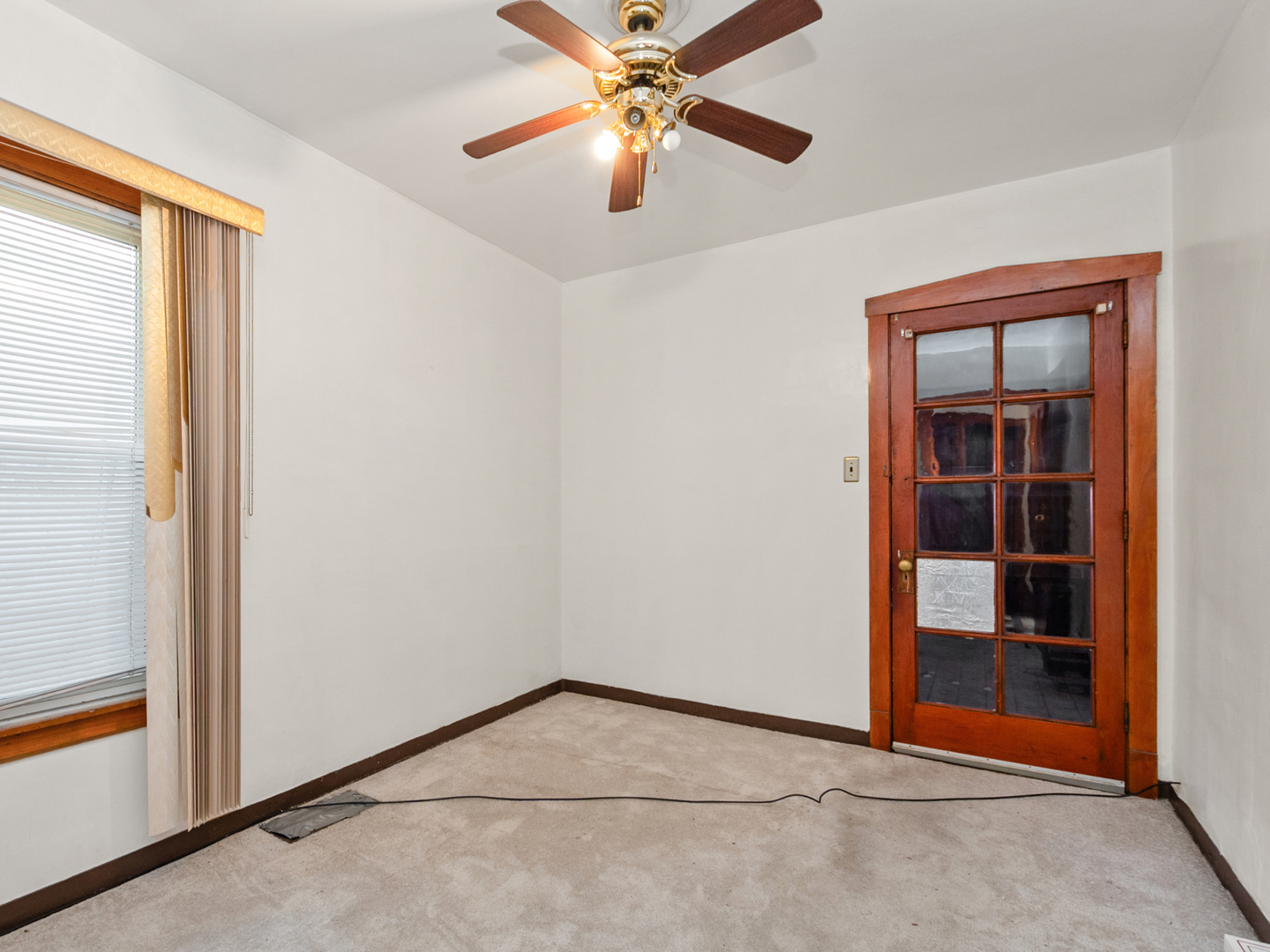 1413 North Long Avenue Chicago, IL 60651 - Photo 9 of 16 an empty room with closet and a chandelier fan