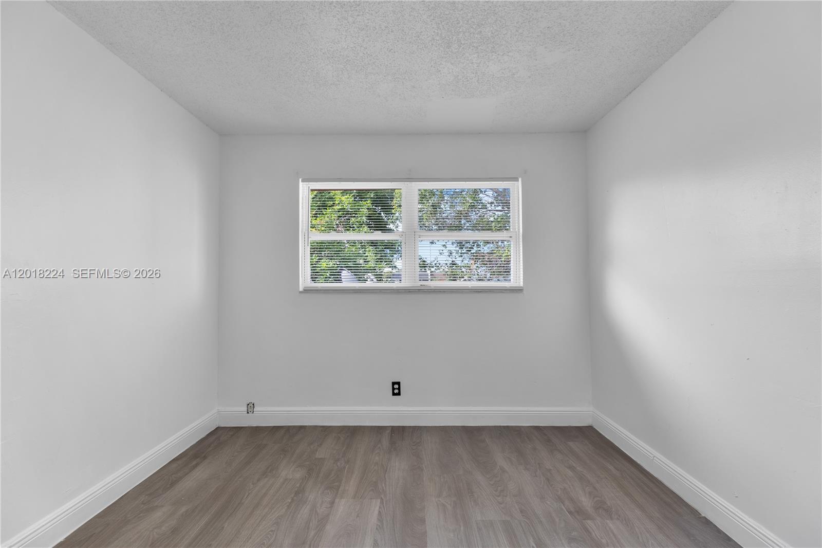 7958 Southwest 6th Street Pompano Beach, FL 33068 - Photo 29 of 57 an empty room with a window