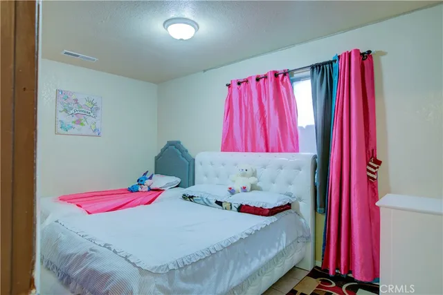 a bedroom with a bed and a bed